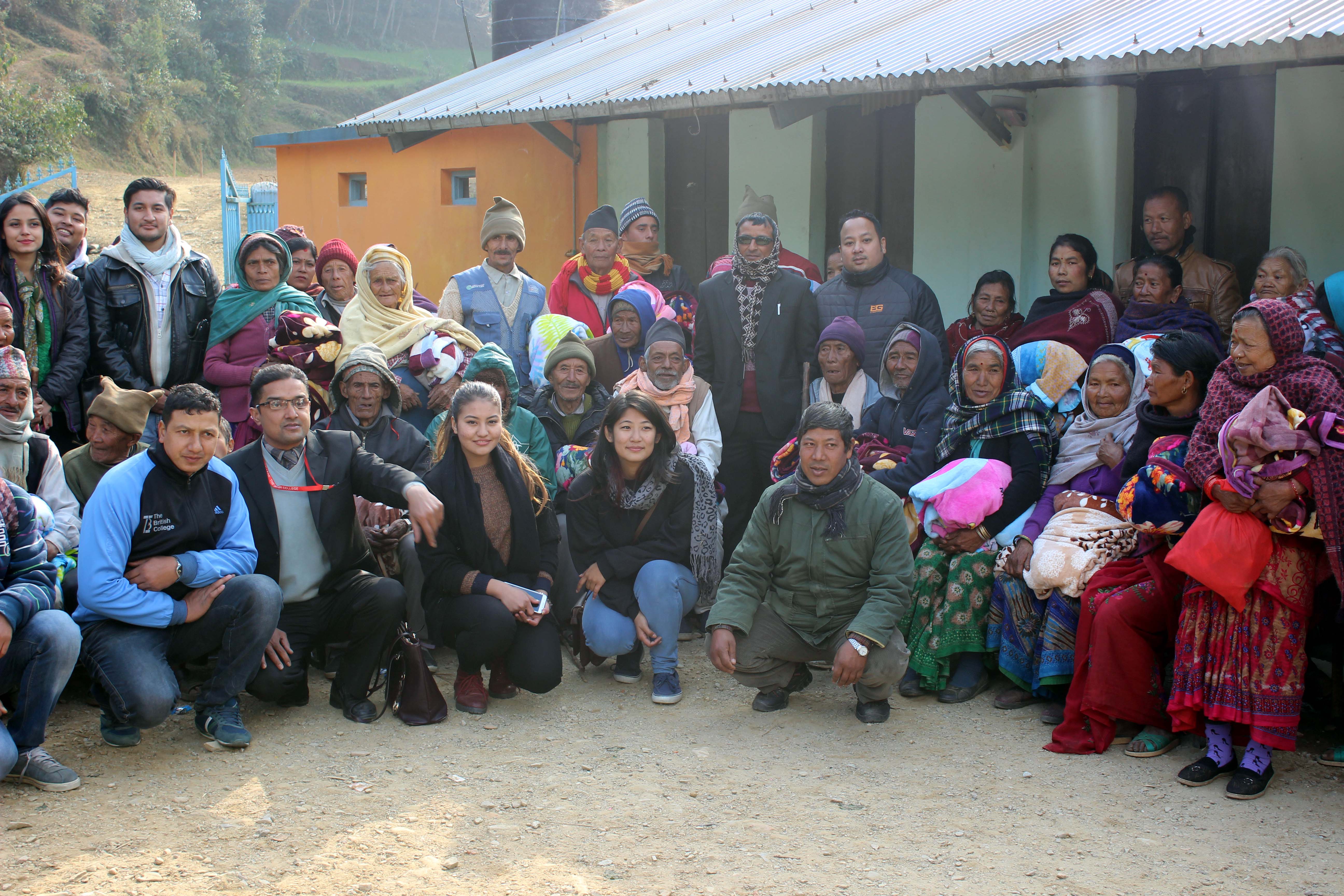 TBC Students handed blanket to elderly people